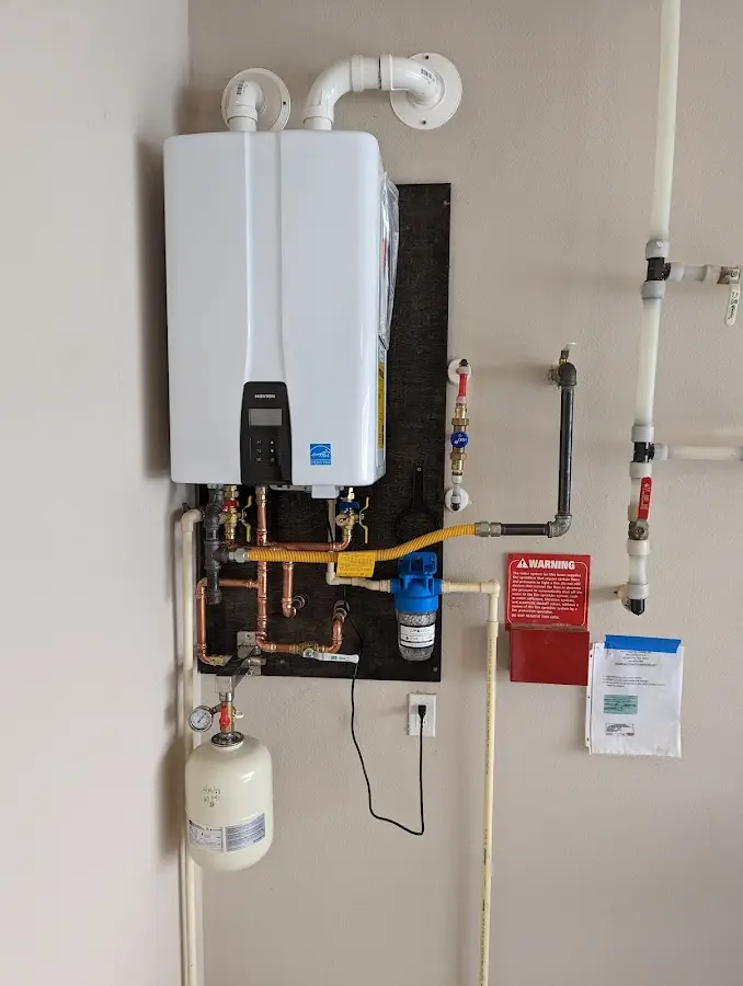 Professional plumber installing copper piping in a Azusa home